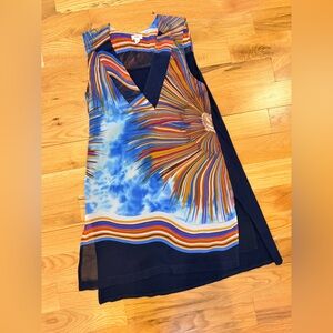 Vibrant Sleeveless Top with Starburst Pattern. Flowy and flattering